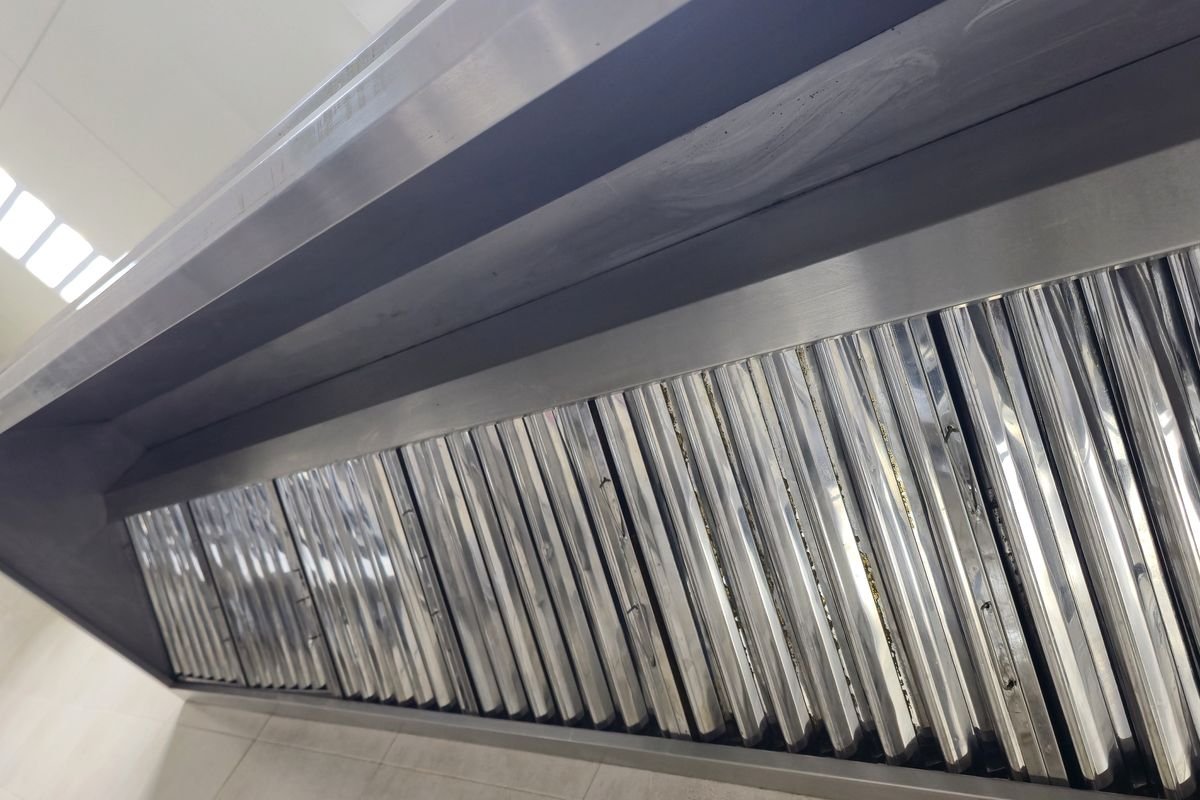 Commercial canopy and filters restored to bare stainless steel after degreasing