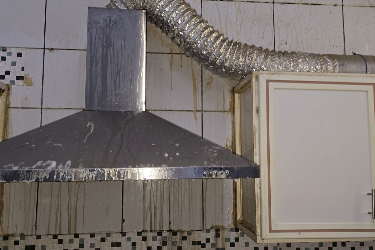 Kitchen hood and duct coated in grease before degreasing