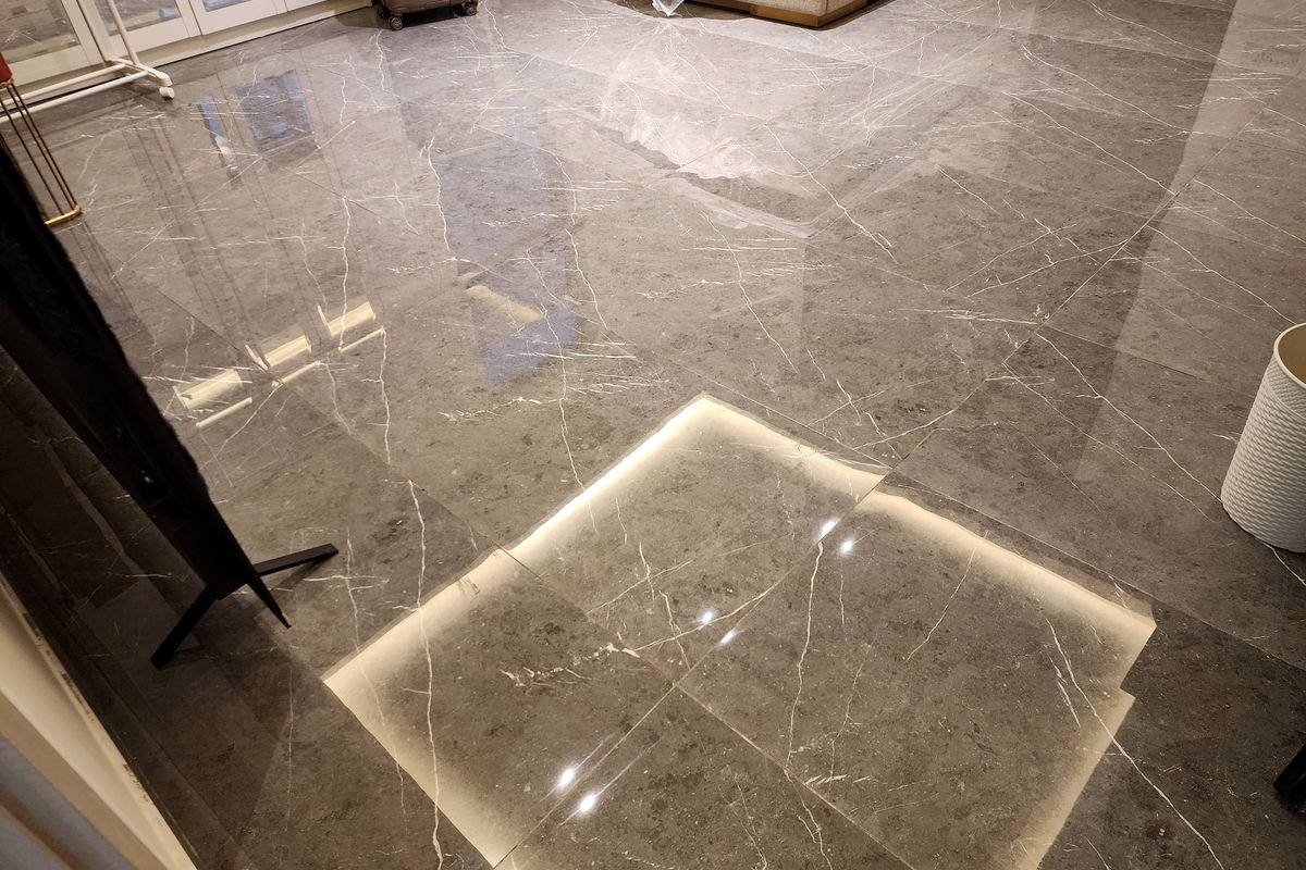 Marble floor restored to a reflective finish after machine scrubbing