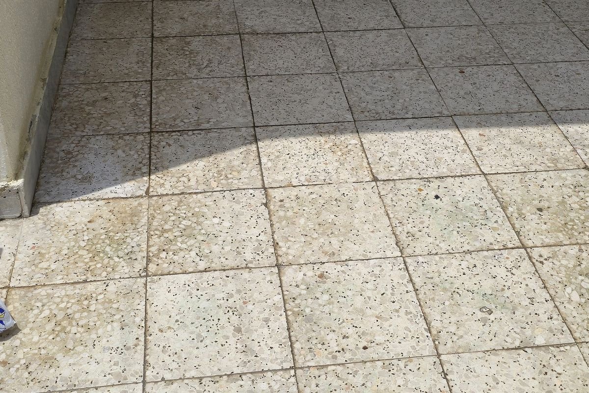 Courtyard tiles clean and even after controlled pressure washing