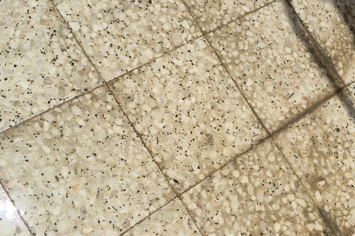 Courtyard corner with ingrained dirt before pressure washing