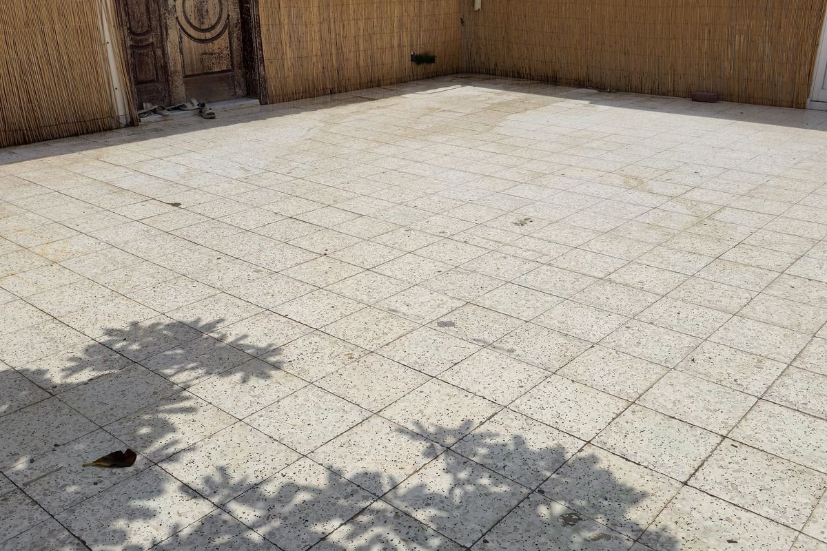 Villa patio paving back to its original colour after pressure washing